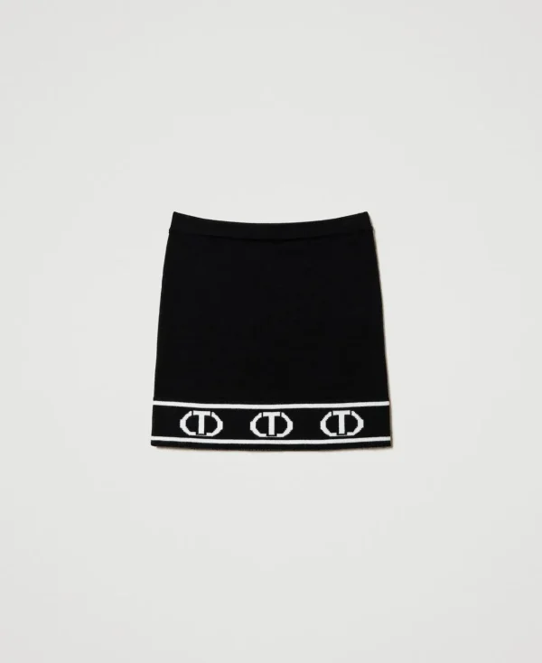 jupe_courte_en_maille_ave_1.webp Jupes*TWINSET Milano Jupe Courte En Maille Avec Oval T Jacquard Bicolore Noir / Blanc Cassé