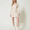 minijupe_en_maille_jacqua_2.webp Jupes*TWINSET Milano Mini-jupe En Maille Jacquard Point Filet Blanc « Old White »