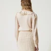 minijupe_en_maille_jacqua_4.webp Jupes*TWINSET Milano Mini-jupe En Maille Jacquard Point Filet Blanc « Old White »